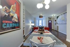 a living room with two chairs and a table at Unique DC Row House Near Historic H Street! in Washington