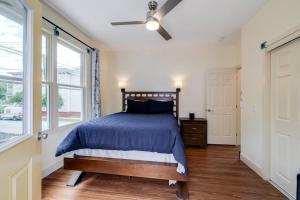a bedroom with a bed and a ceiling fan at Judy's Nest at the Wessels-Boyd House. in Savannah