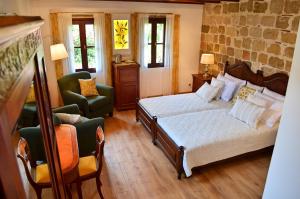 Postel nebo postele na pokoji v ubytování Hotel Ellique