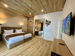 a bedroom with a large bed in a room at PANORAMA Chalet MOUNTAIN RESIDENCE in Bukovel +94 photos