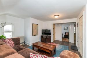 a living room with a couch and a coffee table at Ideally located 2BR Winooski Apt in Winooski