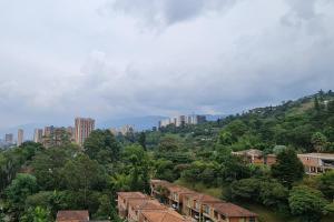 a view of a city with buildings and trees at Sabaneta-Apto familiar in Sabaneta