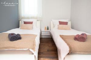 Postel nebo postele na pokoji v ubytování Lana apartman