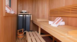 a sauna with a wooden counter and a bench at Hôtel La Pérouse Nice Baie des Anges in Nice