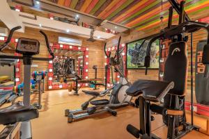 a gym with several treadmills and exercise bikes at I Love Bell Bottoms Vagator Goa in Anjuna