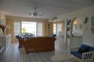 a living room with a couch and a table at Admiral's Quay #5 - Comfortable 1-bed Townhouse townhouse in Rodney Bay Village