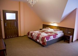 Hotel Odessa tesisinde bir odada yatak veya yataklar