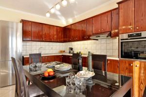 Kuchyň nebo kuchyňský kout v ubytování SG Suites Corfu, A + 13 fotografií