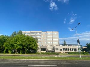 a large building with a street light in front of it at Apartmány Rücon in Martin