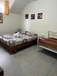 a bedroom with two beds at Centrally Located Private Rooms in Heraklio