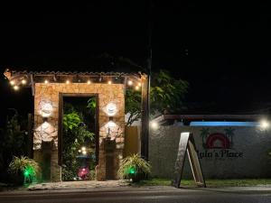 a building with lights on it at night at Lala's Place in Galle