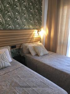 Łóżko lub łóżka w pokoju w obiekcie Superbe appartement avec piscine à 800m de la mer