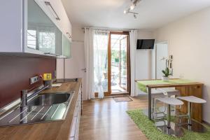 a kitchen with a sink and a counter top at Ferienhaus Am Sedelbach in Deggenhausertal