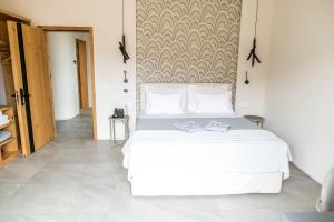 Postel nebo postele na pokoji v ubytování Alissachni SeaSide Hotel