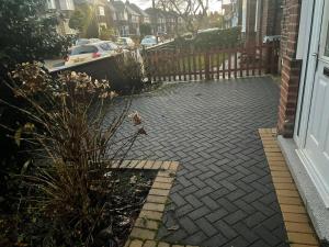 a brick driveway in front of a house at Spacious home near city hospital in Nottingham