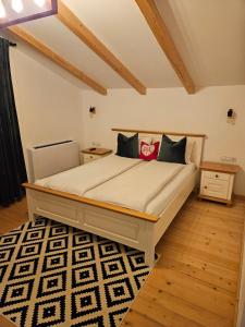 a bedroom with a large bed in a room at Casa Mara Viseu de Sus in Vişeu de Sus