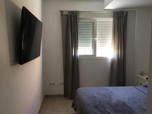 Łóżko lub łóżka w pokoju w obiekcie Superbe appartement avec piscine à 800m de la mer