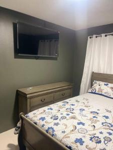 Ένα ή περισσότερα κρεβάτια σε δωμάτιο στο New Kingston Retreat