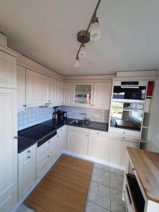 A kitchen or kitchenette at Apartment in Swiss Chalet Träumli