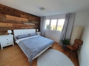 A bed or beds in a room at Apartment in Swiss Chalet Träumli