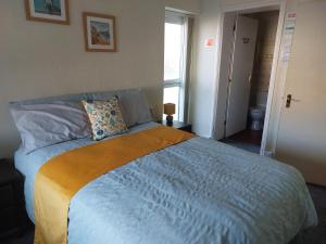 Cama ou camas em um quarto em Sea Air B&B
