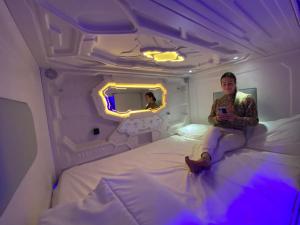 Ένα ή περισσότερα κρεβάτια σε δωμάτιο στο CAPSULE INN VALENCIA Hostel