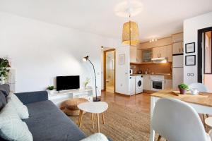 a living room with a couch and a table at La Casita de Majanicho in La Oliva +14 photos