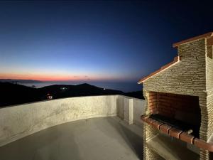 a view from the balcony of a house at night at Résidence plage Oued Tanger in Skikda