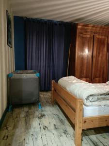 a bedroom with a bed and a canopy at Maison au calme sur une propriété de 40 hectares in Bassillac