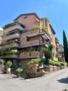 a tall brick building with plants on the side of it at Green & relax near S.Peter in Rome