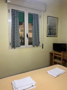 TV a/nebo společenská místnost v ubytování Albergo pensione Bianco