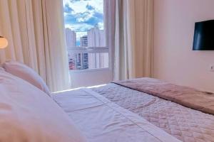 Un pat sau paturi într-o cameră la Blend Smart Marista 2 Quartos