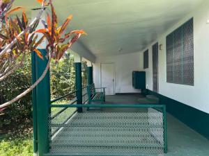 a hallway of a building with stairs and a plant at Ziara Apartments in Nadi