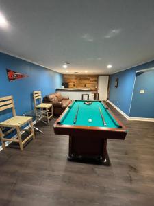 a living room with a pool table in a room at Quiet & Cozy home near Hospitals in Cleveland