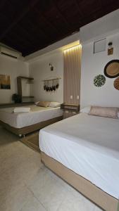 2 camas en una habitación con en HOTEL BOHO BOUTIQUE en Quibdó