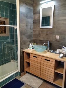 a bathroom with a sink and a shower at Rosemary Cottage in Sergines