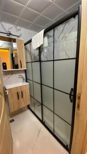 a bathroom with a sink and a mirror at Pilot hotel in Arnavutköy