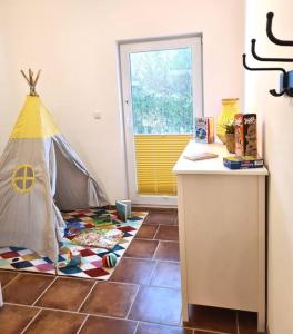 a room with a room with a tent on the floor at Familientraum auf 120 m2 in Rostock in Rostock