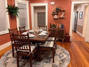 a dining room with a wooden table and chairs at Cozy as a Sunday - 2/BR sleep 6 in Everett