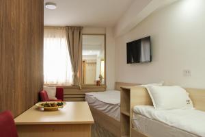 TV a/nebo společenská místnost v ubytování Apartments Pavle