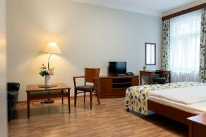 Postel nebo postele na pokoji v ubytování Hotel Orion