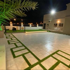 an empty patio at night with a light at فيلا 109 الطائف الشفا in Al Shafa