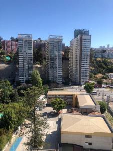 an overhead view of a city with tall buildings at Espectacular departamento in Viña del Mar