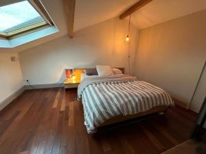 a bedroom with a bed in a room with a window at Chambre privée Lyon in Lyon