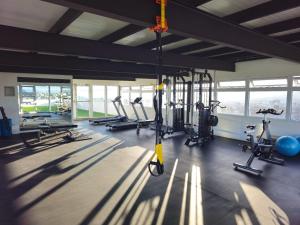 a gym with several treadmills and machines in a room at Torre Pamplona 102-Nuevo y Céntrico-Apartamento in Guatemala
