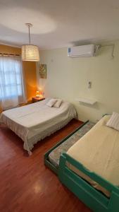 Una cama o camas en una habitación de Ruca Epu