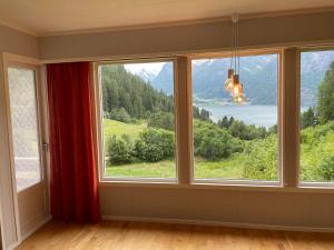 a room with a window with a view at Tunold Gård - Olahuset in Oppstryn