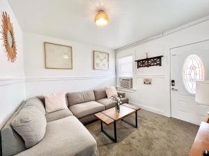 a living room with a couch and a table at Alwaves Family 3 Bedroom Beach Apartment in Wildwood