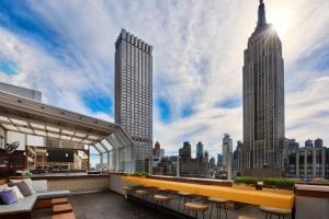 a rooftop bar with a view of the city at Marriott Vacation Club Pulse, New York City in New York