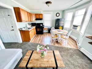 a living room with a table and a kitchen at Entire Lovely 3 Bedroom, 2 Bathroom Apartment! 1 Block to the Beach and Boardwalk! in Wildwood +8 photos